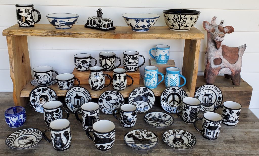 a shelf with beautiful sgraffito porcelain pottery