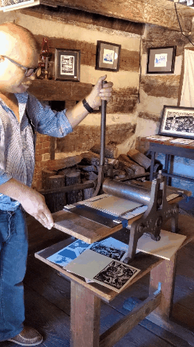 artist ken swinson printing with an old fashioned press