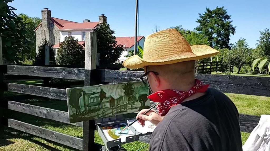 Artist painting the stone house in May's Lick Kentucky