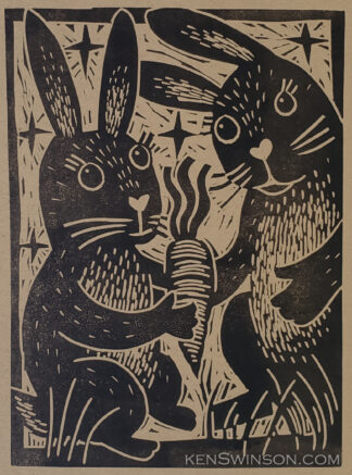 linocut of two bunnies sharing a carrot