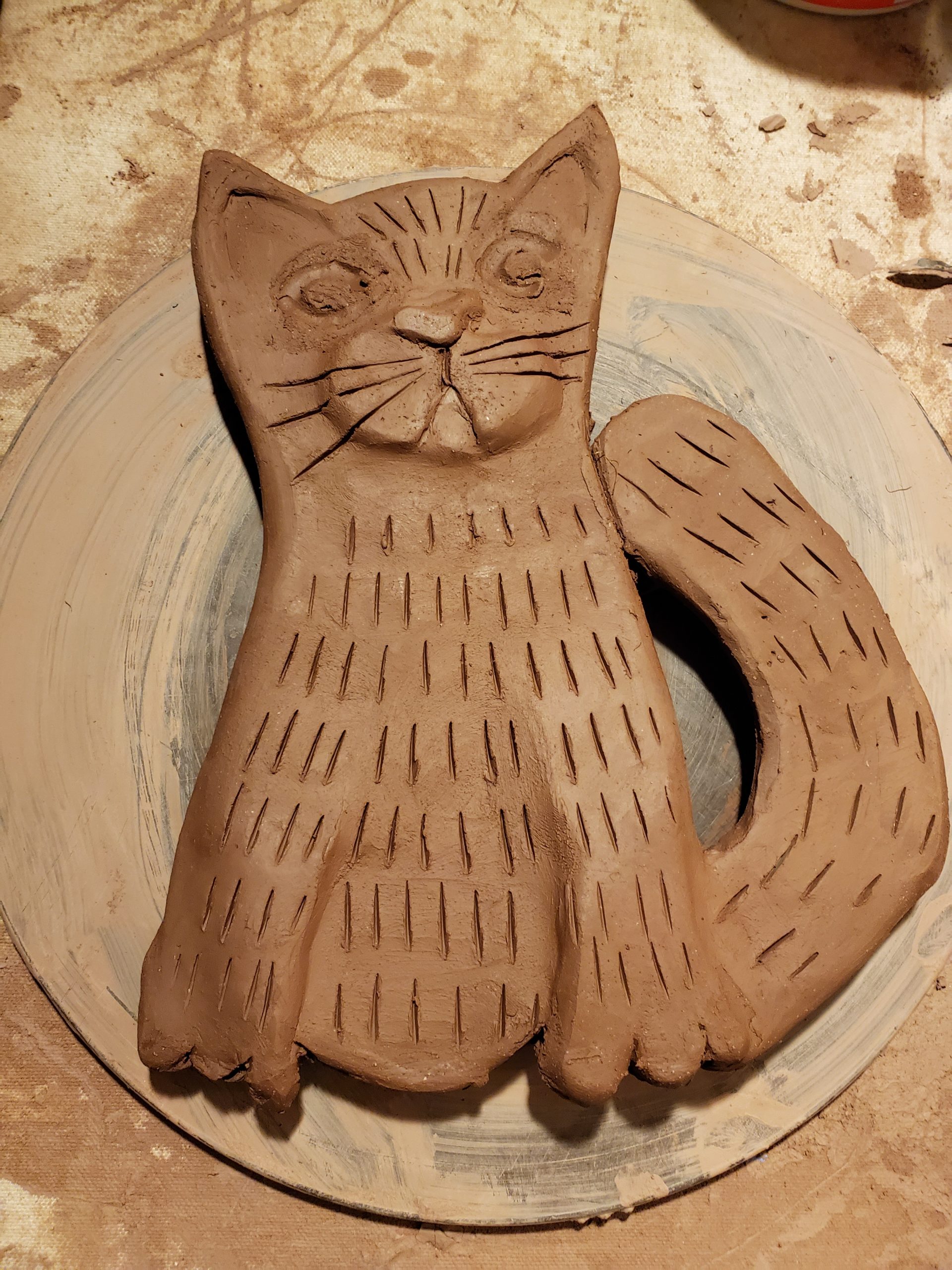 clay sculpture of a cat