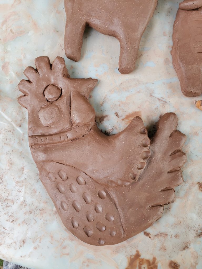 clay sculpture of a chicken hen
