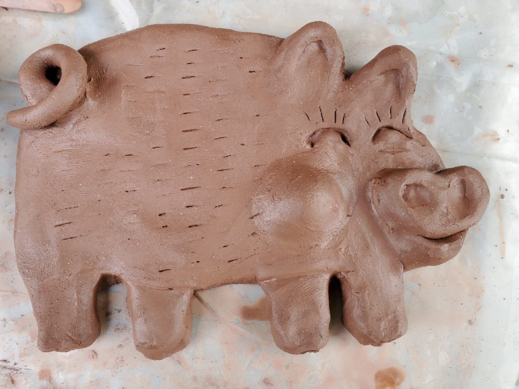clay sculpture of a pig
