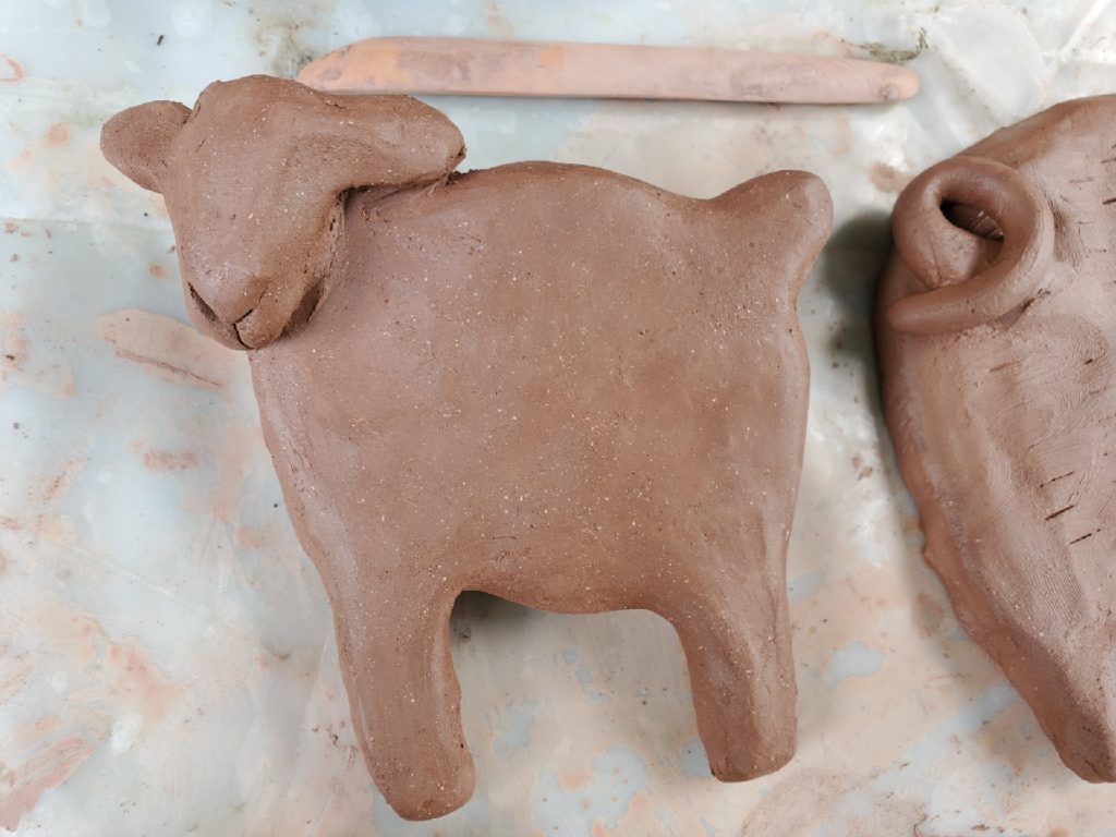 clay sculpture of a sheep