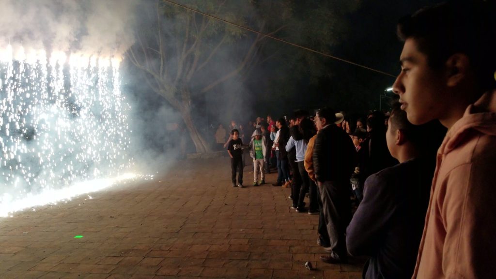 people enjoying fireworks at san pablo huitzo