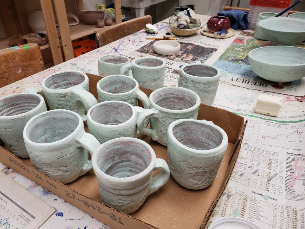 glazed mugs before being fired