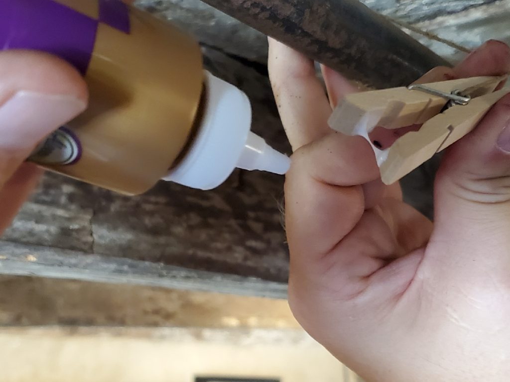 gluing paper to clothespins