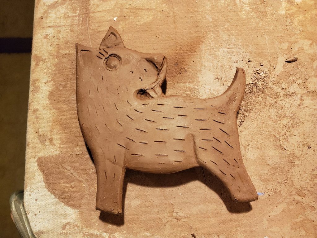 clay sculpture of a dog