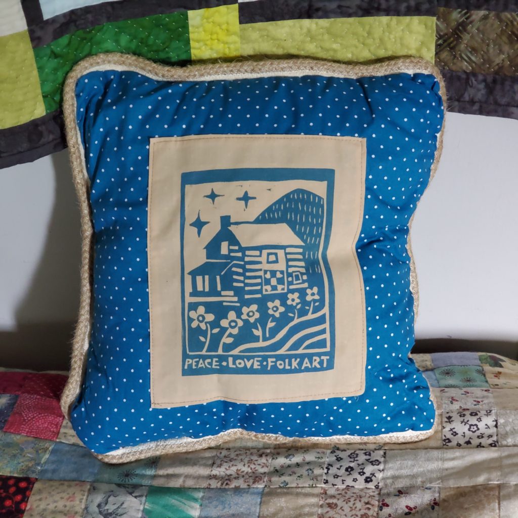 beautiful blue pillow featuring block print on fabric by kentucky artist ken swinson