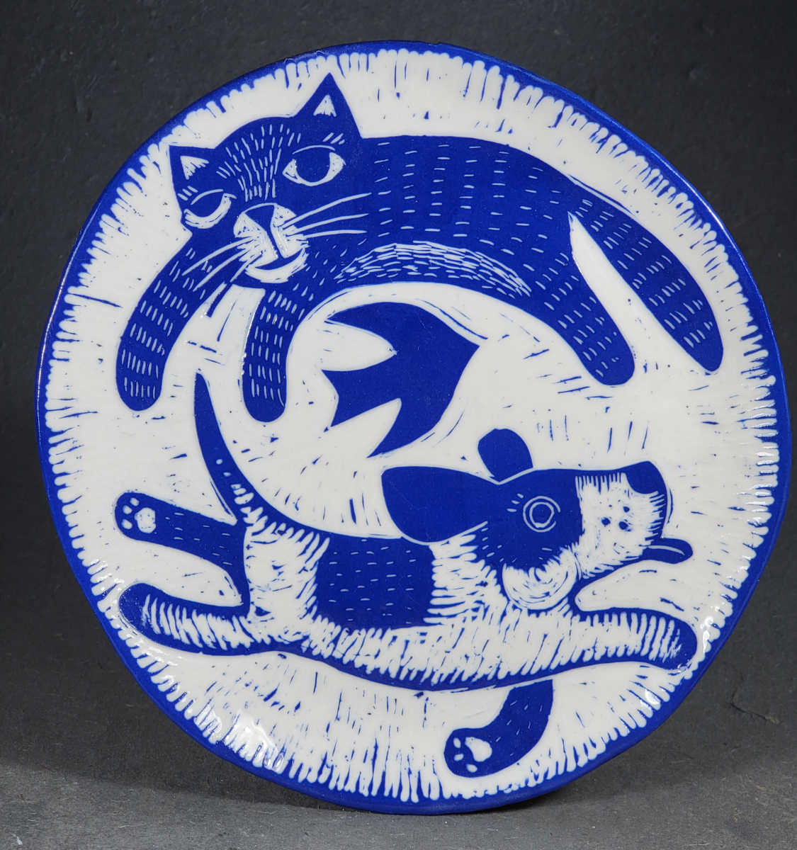 folk art style porcelain plate with cat bird and dog