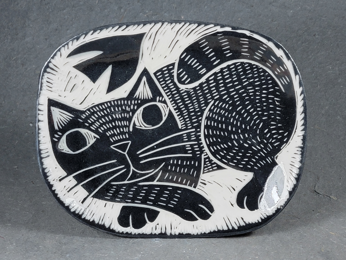 folk art style porcelain plate with cat and bird