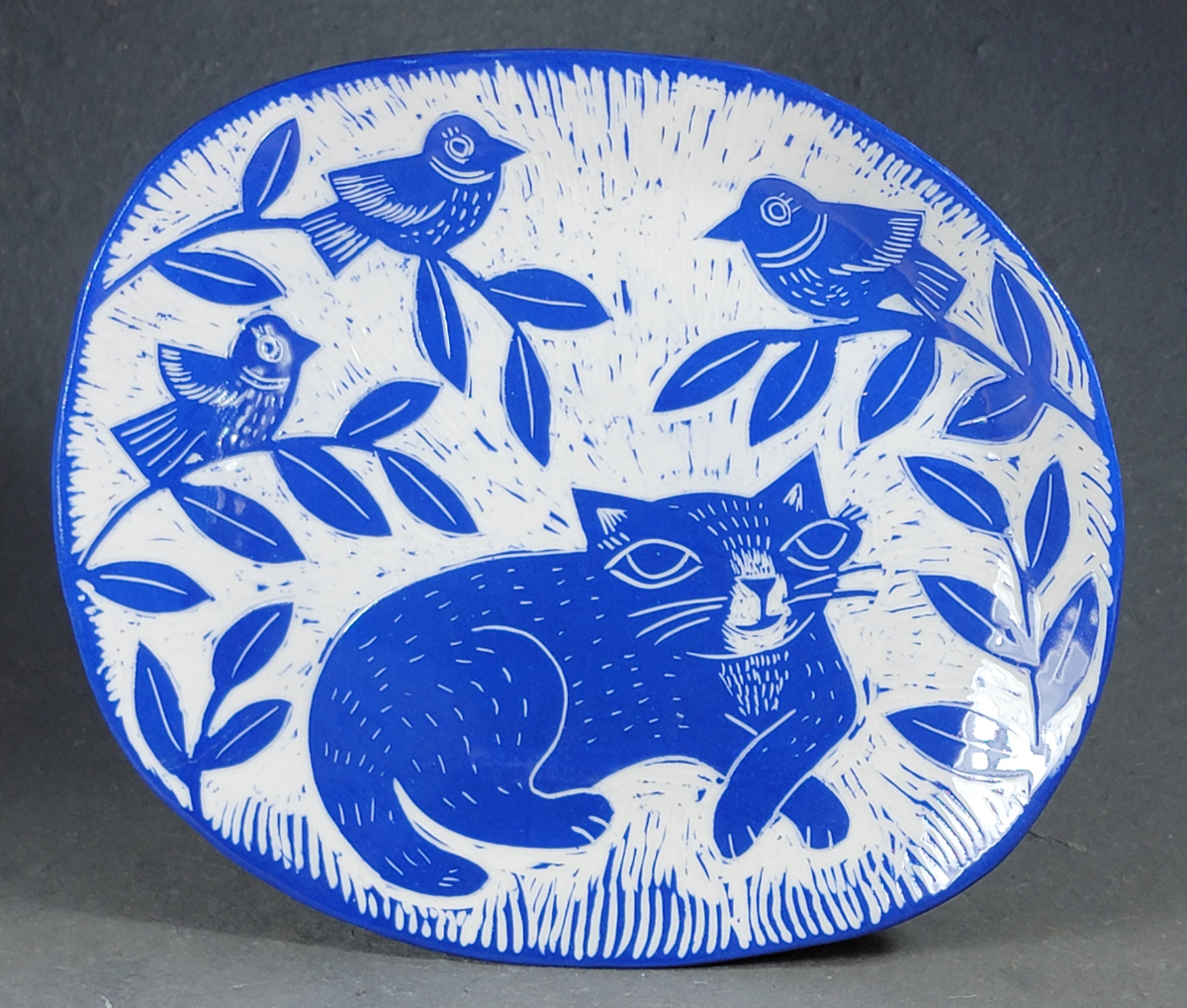 folk art style porcelain plate with cat and birds