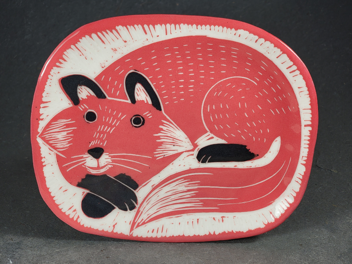 folk art style porcelain plate with fox