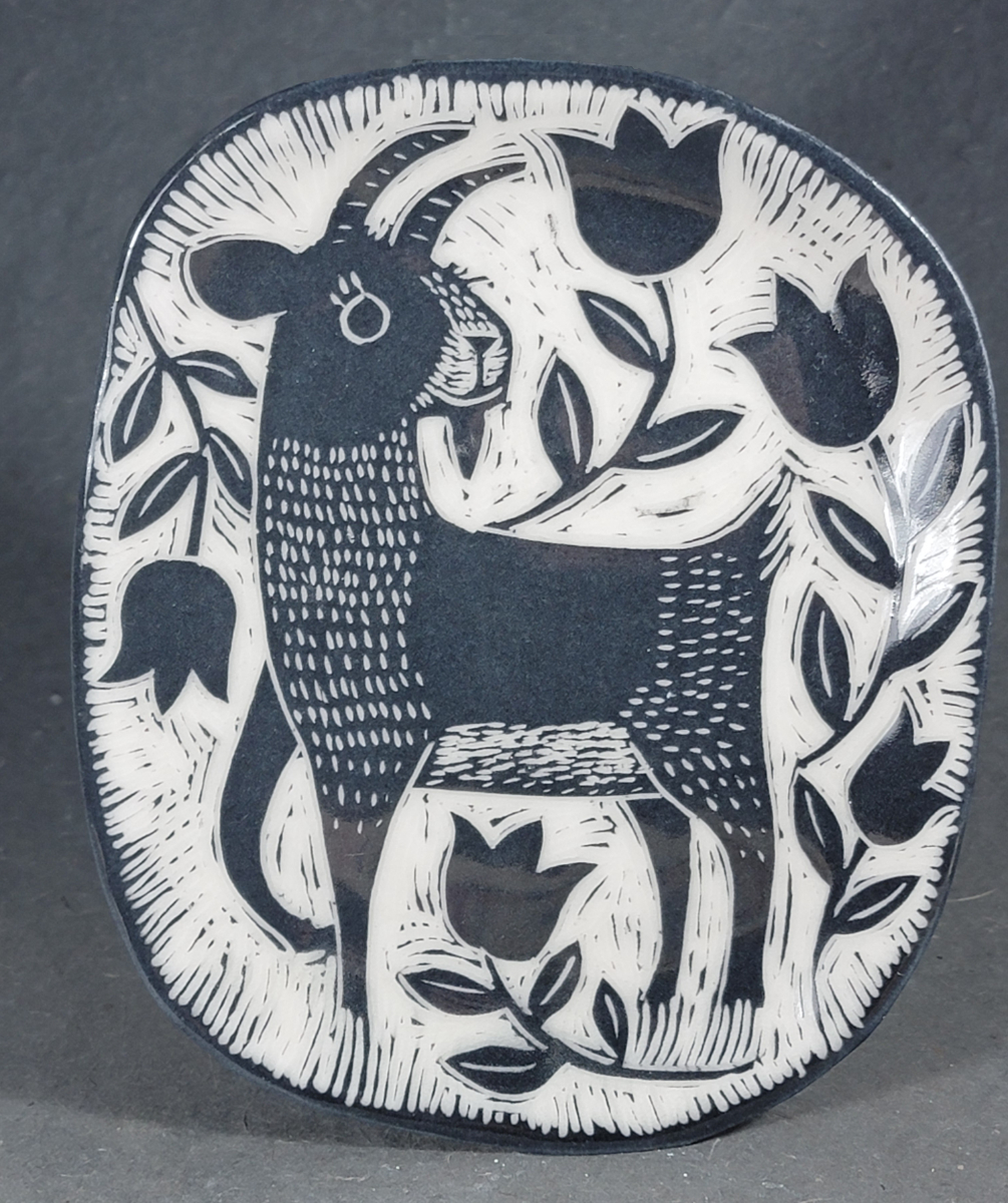 folk art style porcelain plate with goats and tulips
