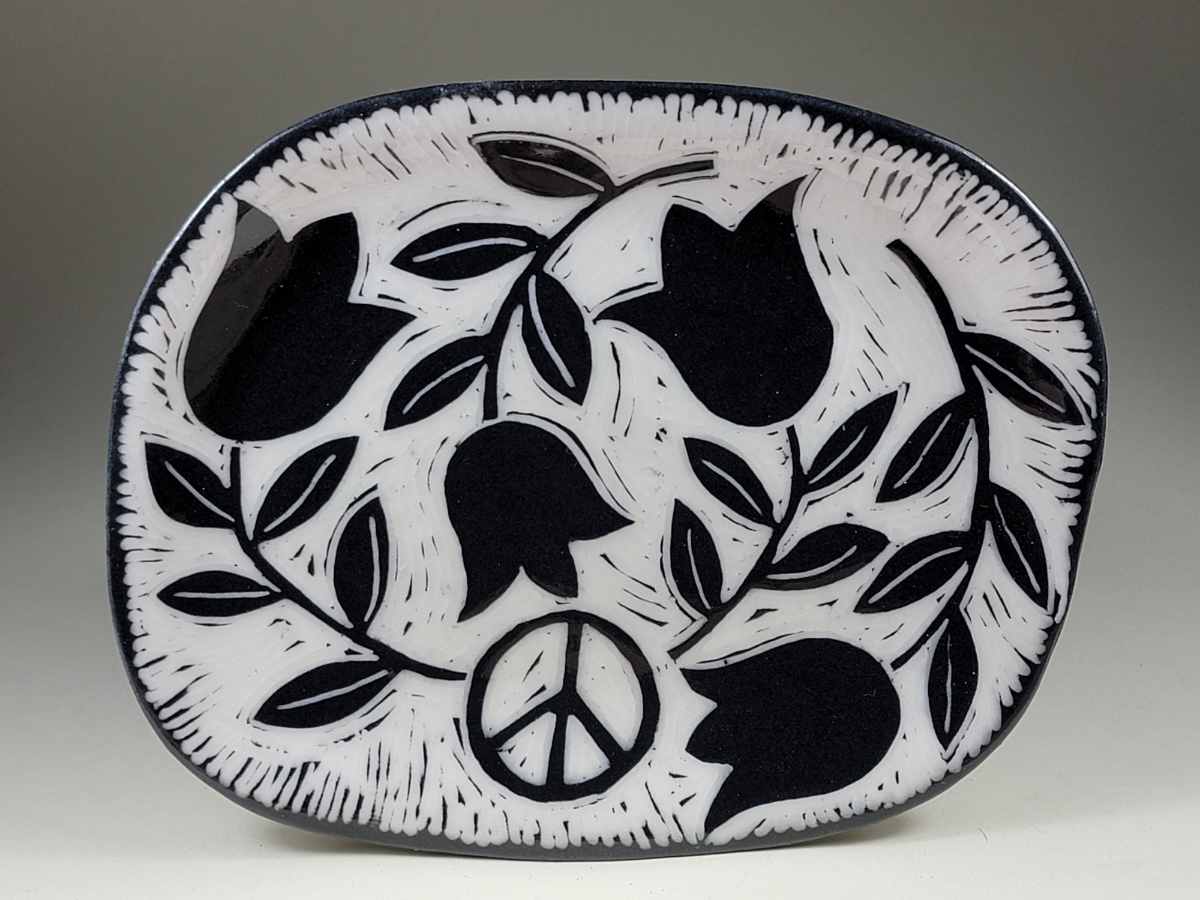 porcelain plate with tulips and peace symbol sgraffito design