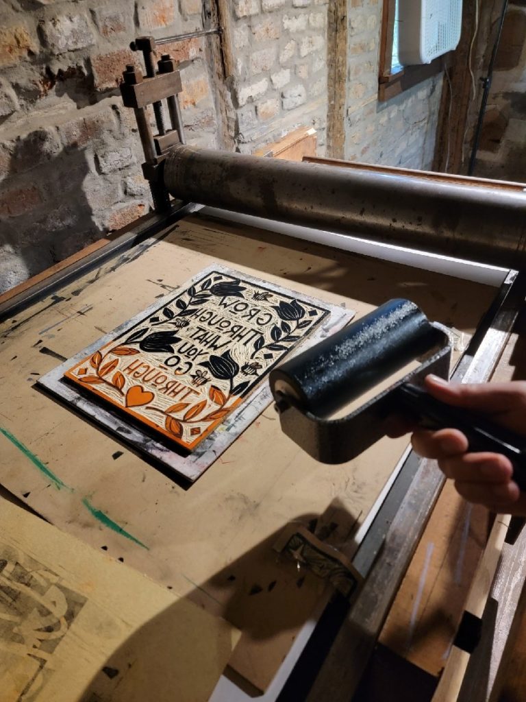rolling ink on the woodcut print