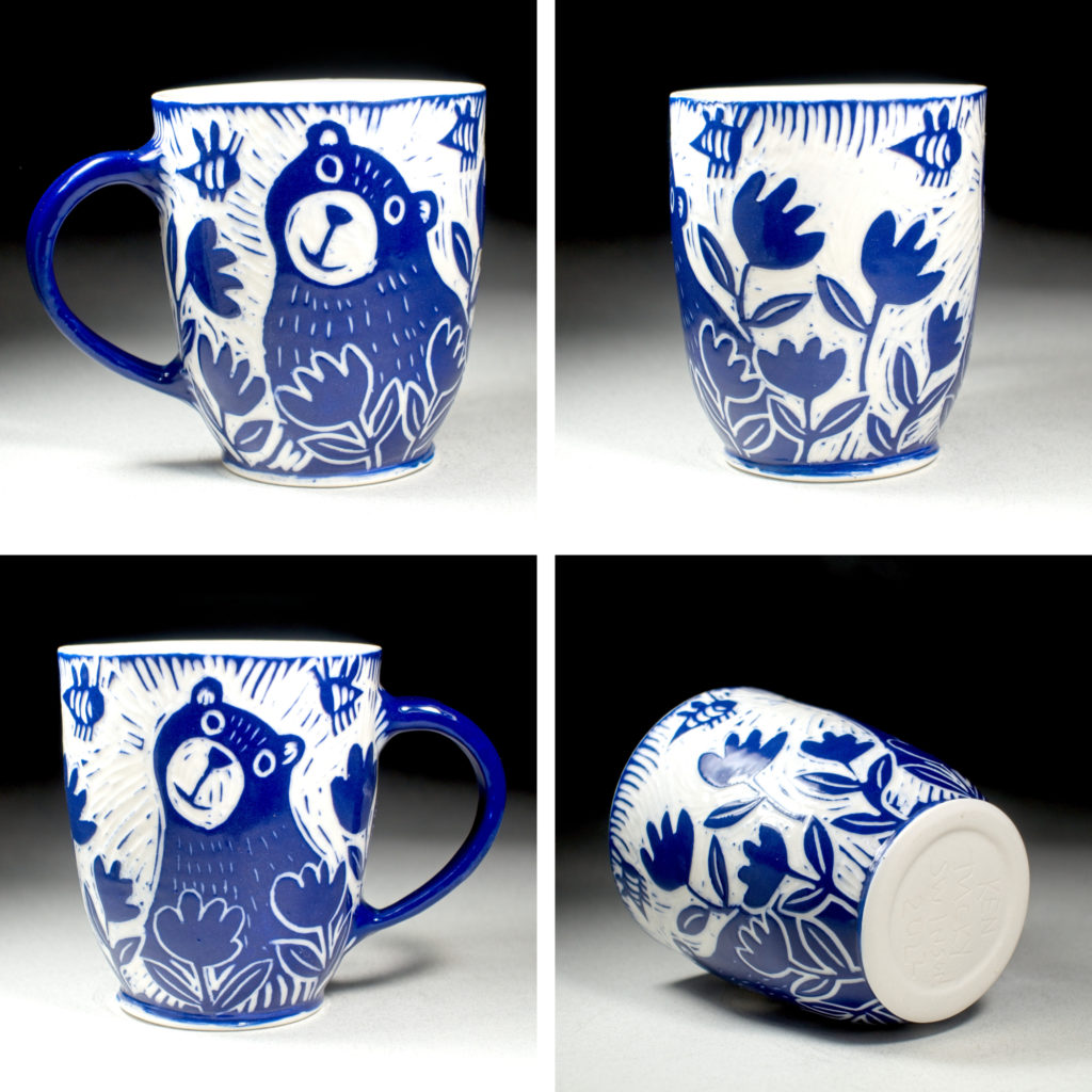 porcelain blue cup with bear and flowers by kentucky artist ken swinson