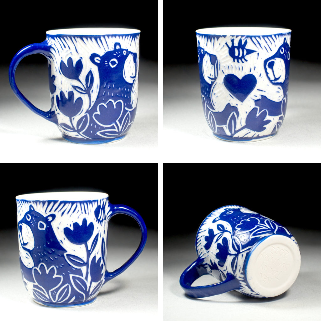 blue porcelain cup with two bears and a heart by kentucky artist ken swinson