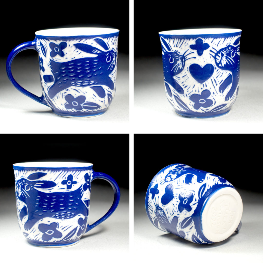 porcelain pottery cup blue with heart and bunny by kentucky artist ken swinson