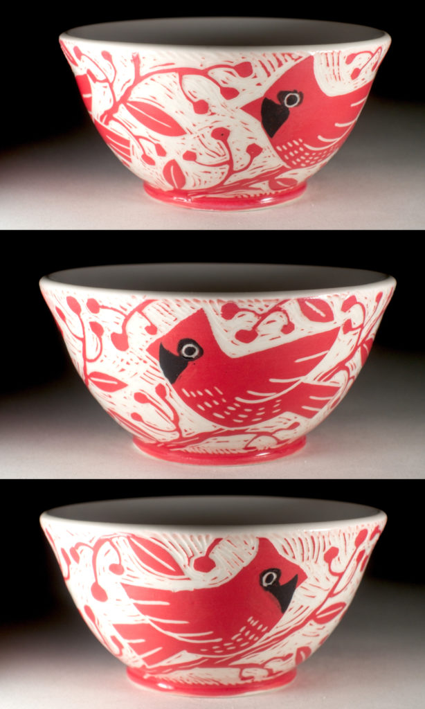 red porcelain bowl with a cardinal design by kentucky artist ken swinson