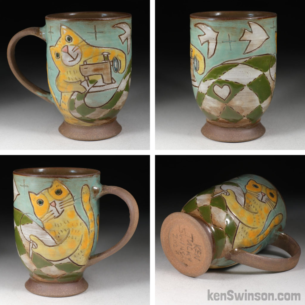 handmade stoneware cup with surface design of yellow cats sewing a quilt