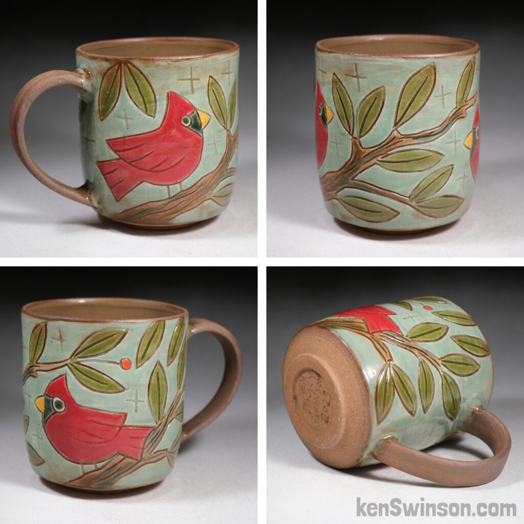handmade cup with folk art style cardinal surface design