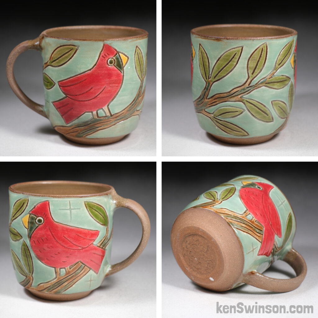 handmade cup with folk art style cardinal surface design