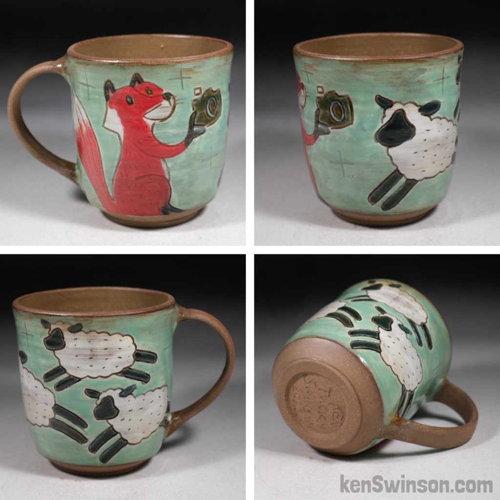 handmade stoneware cup depicting fox taking photos of sheep