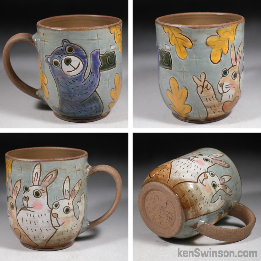 handmade stoneware cup with bear taking photos of bunnies design
