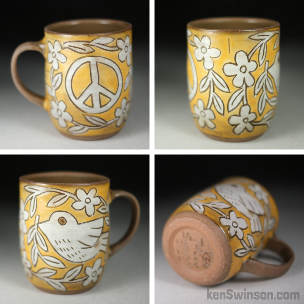 handmade stoneware cup with dove and peace symbol surface design