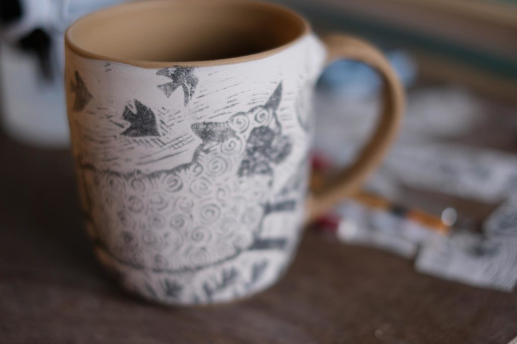 screen print transfer on an unfired stoneware mug