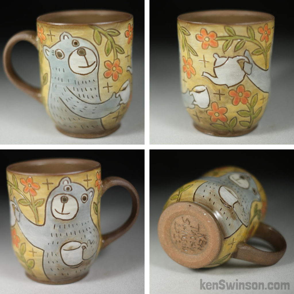 handmade stoneware cup with bears having tea party surface design