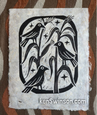 hand printed linocut depicting crows on cornstalks
