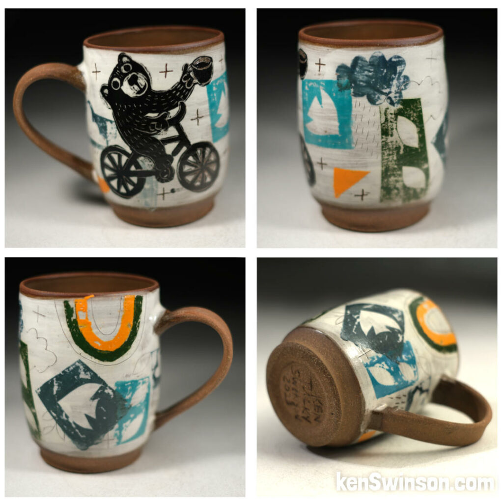folk art pottery cup with bear on bicycle design colorful
