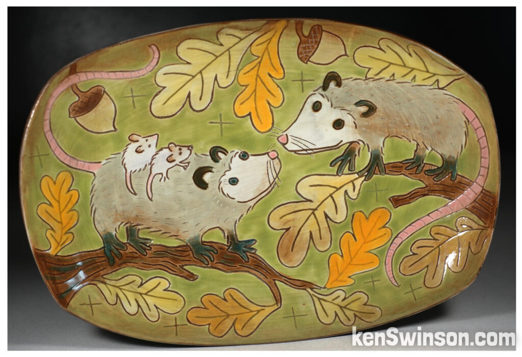 handmade pottery plate with 2 opossum surface design made in kentucky