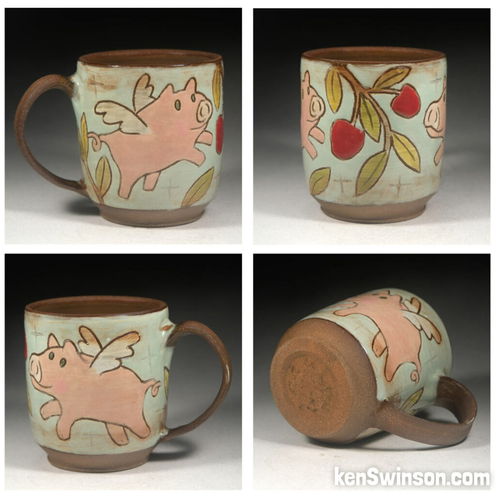 folk art pottery wheel thrown cup made in kentucky with flying pigs eating apples from a tree