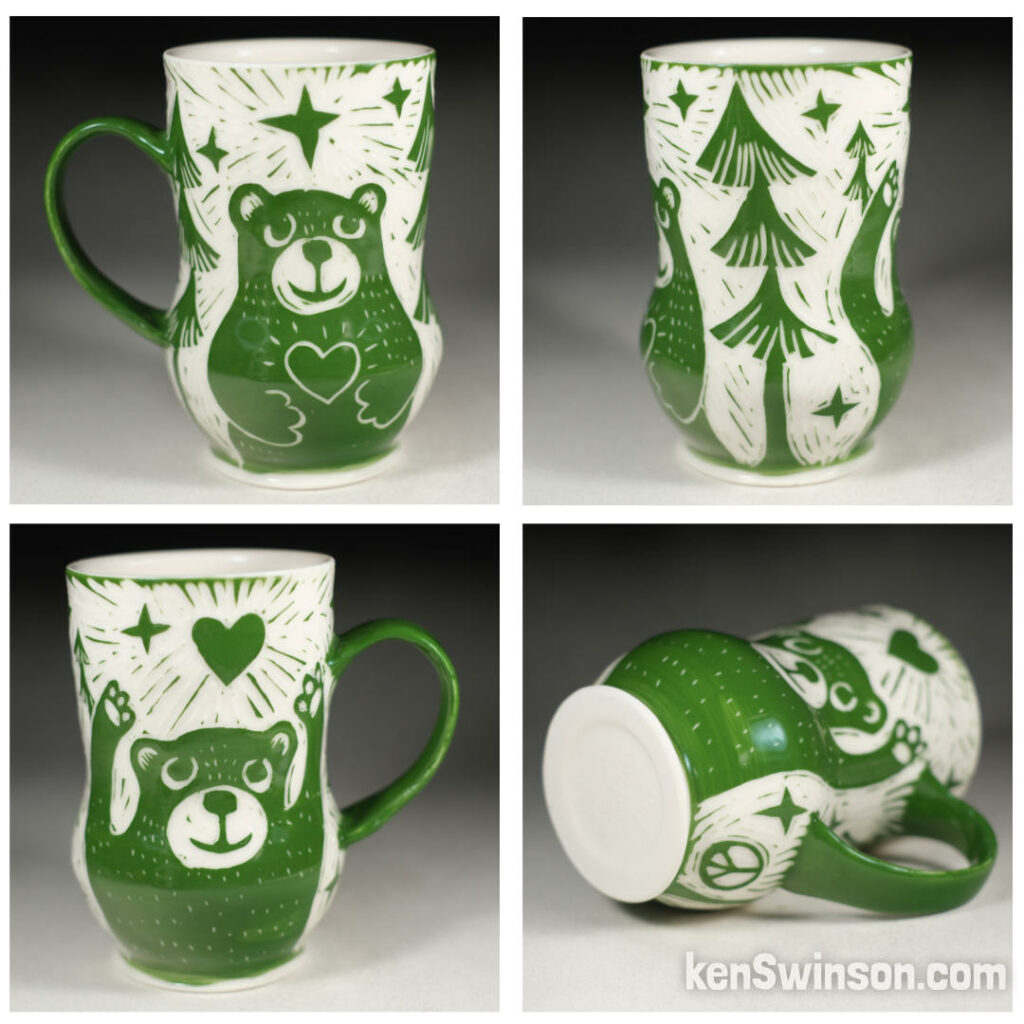 handmade porcelain cup by kentucky artist ken swinson. surface design is green with a bear holding a heart