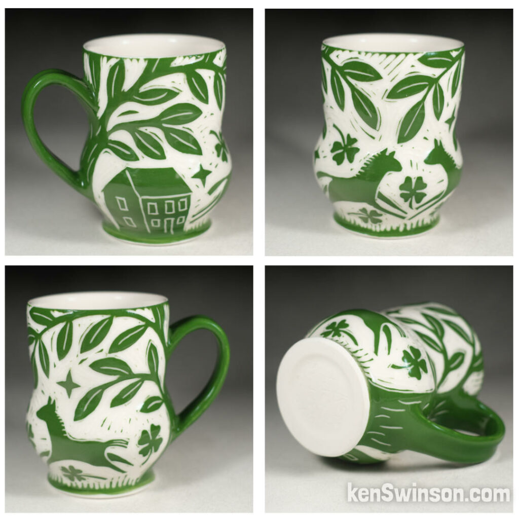 handmade porcelain cup by kentucky artist ken swinson. surface design is green with horses running around four leaf clovers